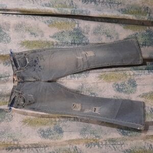 33" waist super low cut flare Levi's ripped jeans with original artwork